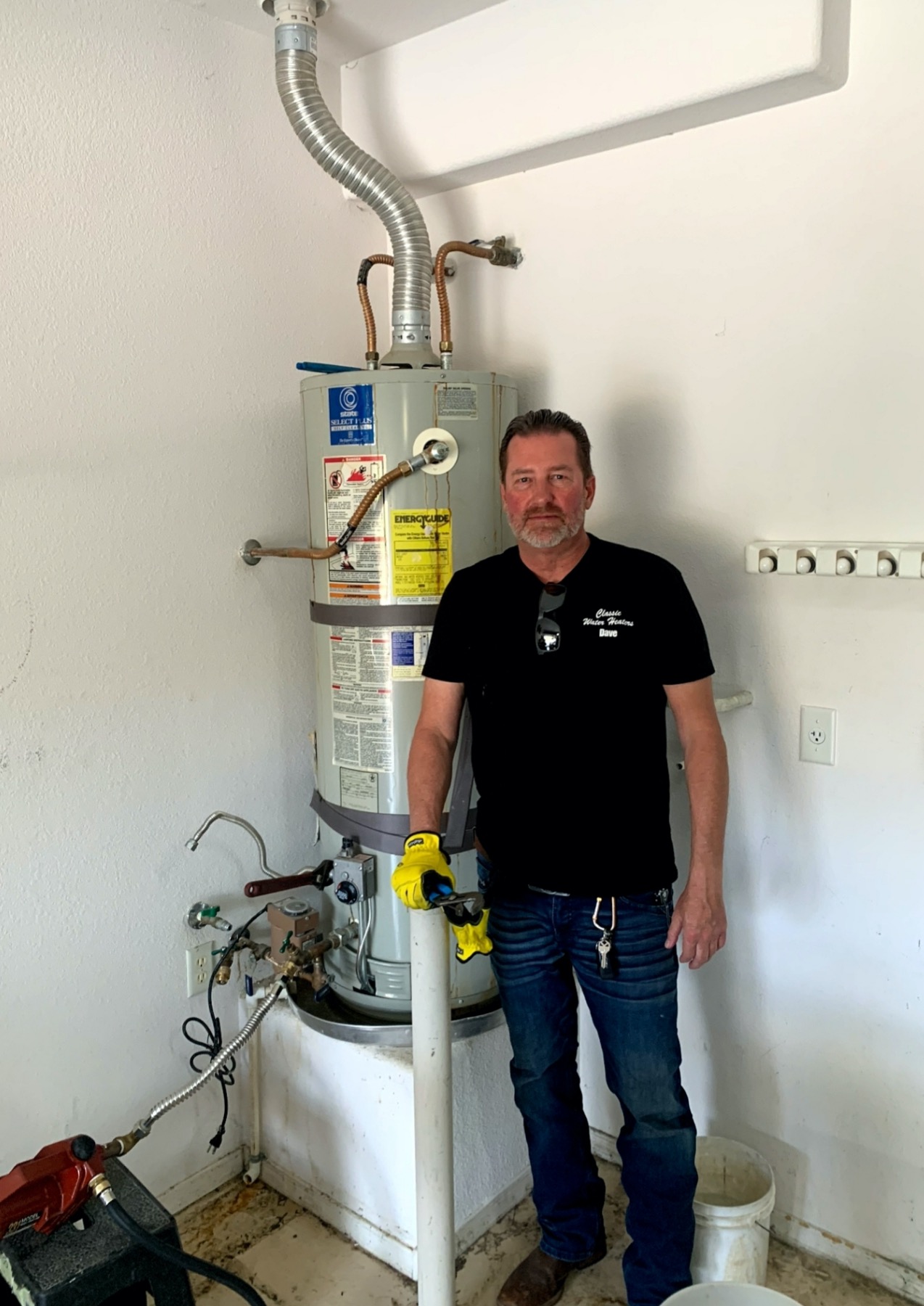 Classic Water Heaters technician servicing a residential water heater